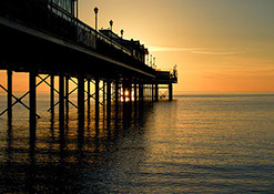 Paignton Pier in the early morning as the sunrises.
